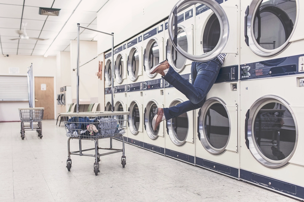 Stackable washer dryer in laundry room